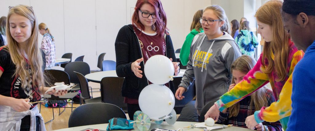 young female students conducting research for multiply your options