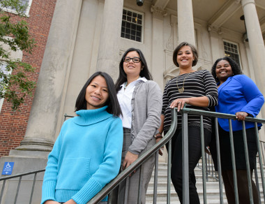 Quan Tran, left, Melissa Huerta, Amanda Almond, and LaToya Eaves, all Predoctoral Fellows in Residence, pose for a portrait outside the Wilbur Cross Building on Oct. 30, 2013. (Peter Morenus/UConn Photo)