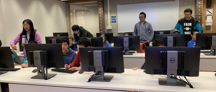 students on computer lab with supervisors