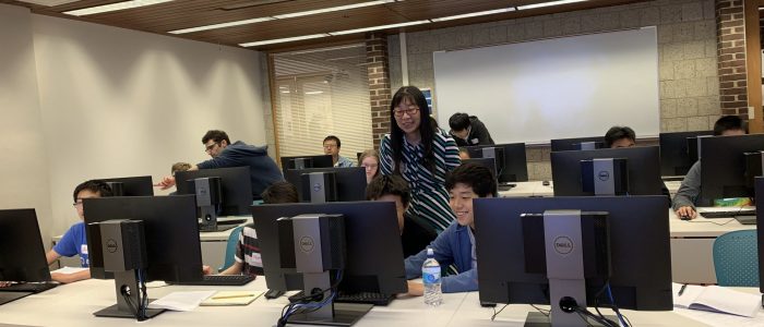 students on computer lab with supervisors